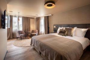 Postel nebo postele na pokoji v ubytování Hotel Britannia