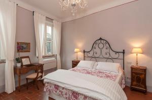 Posteľ alebo postele v izbe v ubytovaní B&B Arena di Lucca