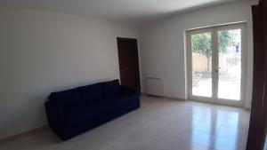 Posteľ alebo postele v izbe v ubytovaní ArmacHouse - Appartamenti sul mare