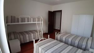 Posteľ alebo postele v izbe v ubytovaní ArmacHouse - Appartamenti sul mare