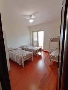 Posteľ alebo postele v izbe v ubytovaní ArmacHouse - Appartamenti sul mare