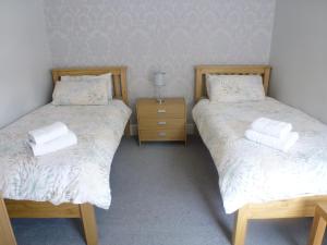 Postel nebo postele na pokoji v ubytování Orrell Park Hotel