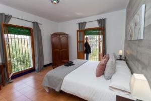 Ein Bett oder Betten in einem Zimmer der Unterkunft Caserio de Iznájar