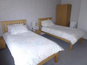 Postel nebo postele na pokoji v ubytování Orrell Park Hotel