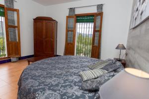 Ein Bett oder Betten in einem Zimmer der Unterkunft Caserio de Iznájar