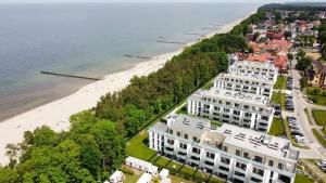 an aerial view of a building next to the beach at Apartament Tęcza in Rewal