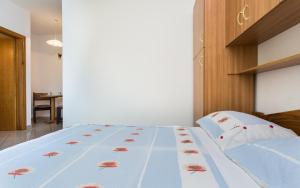 Postel nebo postele na pokoji v ubytování Apartman Justinić