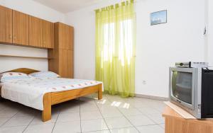 Postel nebo postele na pokoji v ubytování Apartman Justinić