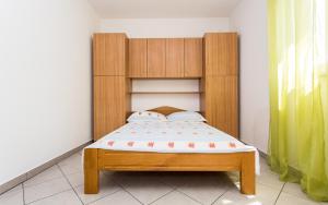 Postel nebo postele na pokoji v ubytování Apartman Justinić