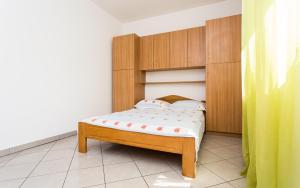 Postel nebo postele na pokoji v ubytování Apartman Justinić