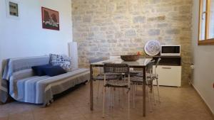 a room with a bed and a table with chairs at Aliki House in Alyki +58 photos