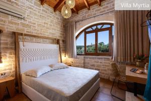 Postel nebo postele na pokoji v ubytování Atsipopoulo Villas