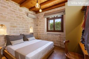 Postel nebo postele na pokoji v ubytování Atsipopoulo Villas