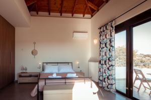 A bed or beds in a room at Harmony Deluxe Villa With Sea Mountain View