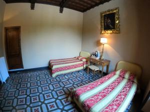 Postel nebo postele na pokoji v ubytování Agriturismo Montecorona