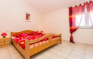 Łóżko lub łóżka w pokoju w obiekcie Apartmani Andreas