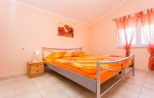Łóżko lub łóżka w pokoju w obiekcie Apartmani Andreas