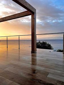 an open deck with a view of the ocean at PUNTA dei BARBARI #MAESTRALE #LIBECCIO #TRAMONTANA in Cavo