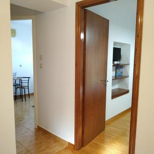 A television and/or entertainment centre at Sandra Apartment