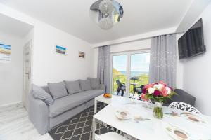 TV a/nebo společenská místnost v ubytování Porta Mare Apartments LuxView III