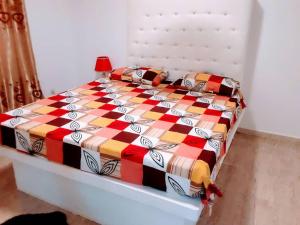 En eller flere senge i et værelse på Villa Charles Senghor