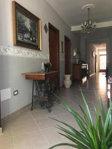 a living room with a desk and a table at Agriturismo La Rosa Spina in Fivizzano