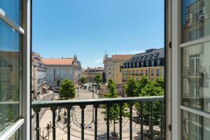 a view of a city from a balcony at Le Consulat in Lisbon
