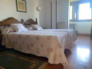 Postel nebo postele na pokoji v ubytování Hotel Siglo XVIII