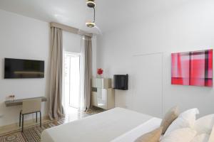 TV a/nebo společenská místnost v ubytování Sopramonte Exclusive Rooms