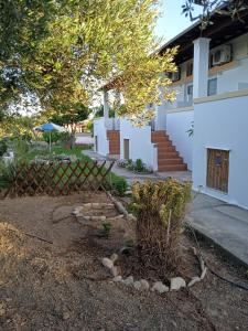 a garden in front of a house at Level Houses in Kefalos