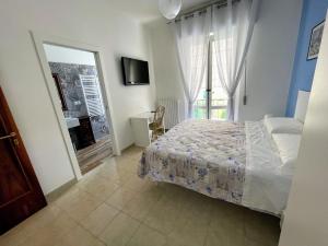 A bed or beds in a room at Casa Rosetta Affittacamere