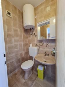 Kúpeľňa v ubytovaní Apartmani i sobe Jusić + 37 fotografií
