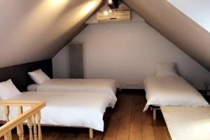 Giường trong phòng chung tại Le petit haut de Meuse
