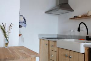 a kitchen with a sink and a counter top at Christou Homes in Steni Vala Alonissos