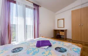Łóżko lub łóżka w pokoju w obiekcie Apartman Ceković