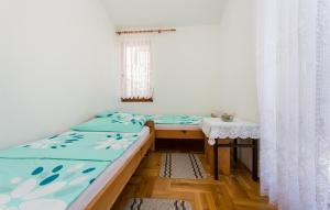 Łóżko lub łóżka w pokoju w obiekcie Apartman Ceković