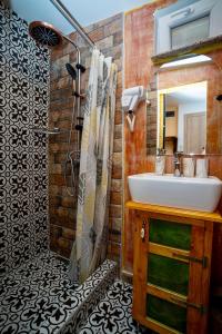 a bathroom with a sink and a mirror at Sebilhan Apart Hotel in Sarajevo +84 photos