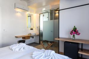 Postel nebo postele na pokoji v ubytování Magas Hotel
