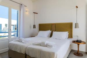 Postel nebo postele na pokoji v ubytování Magas Hotel