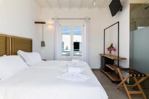 Postel nebo postele na pokoji v ubytování Magas Hotel