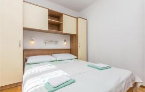 Posteľ alebo postele v izbe v ubytovaní Apartmani Štampar