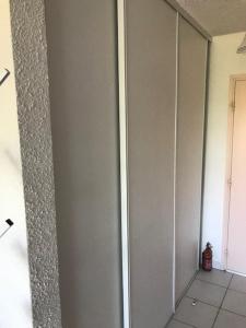 a white wall in a room with a doorway at Corsica studio Face à la mer Moriani plage in San-Nicolao +14 photos