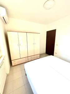 Кровать или кровати в номере Residence Palm Garden