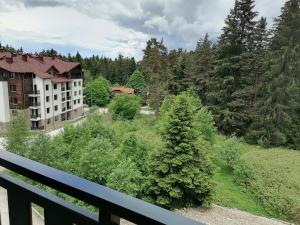 a view from a balcony of a building and trees at Borovets Gardens Studio D36 in Borovets