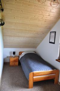 Posteľ alebo postele v izbe v ubytovaní Zagroda Mazury -,,Domki nad Rozlewiskiem"