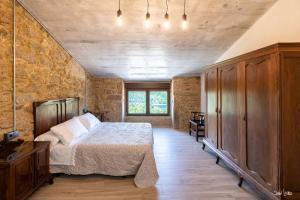 A bed or beds in a room at O AGOCHO DA MOA