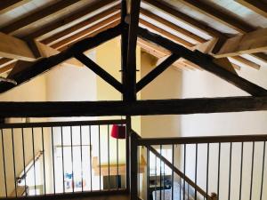 a view from the inside of a barn with a wooden ceiling at MaBelle rêve B&B in Saint-Pierre-de-Côle