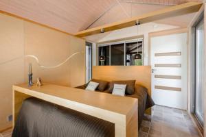 a living room with a couch and a table at Reelinki Seafront Villas, Villa Amando & Villa Aava in Pori