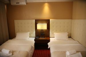 Postel nebo postele na pokoji v ubytování Orbis Design Hotel & Spa