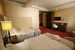 Postel nebo postele na pokoji v ubytování Orbis Design Hotel & Spa